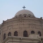 closeup of cathedral with dome and cross