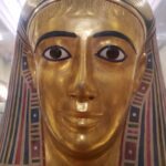 golden Egyptian sarcophagus with makeup
